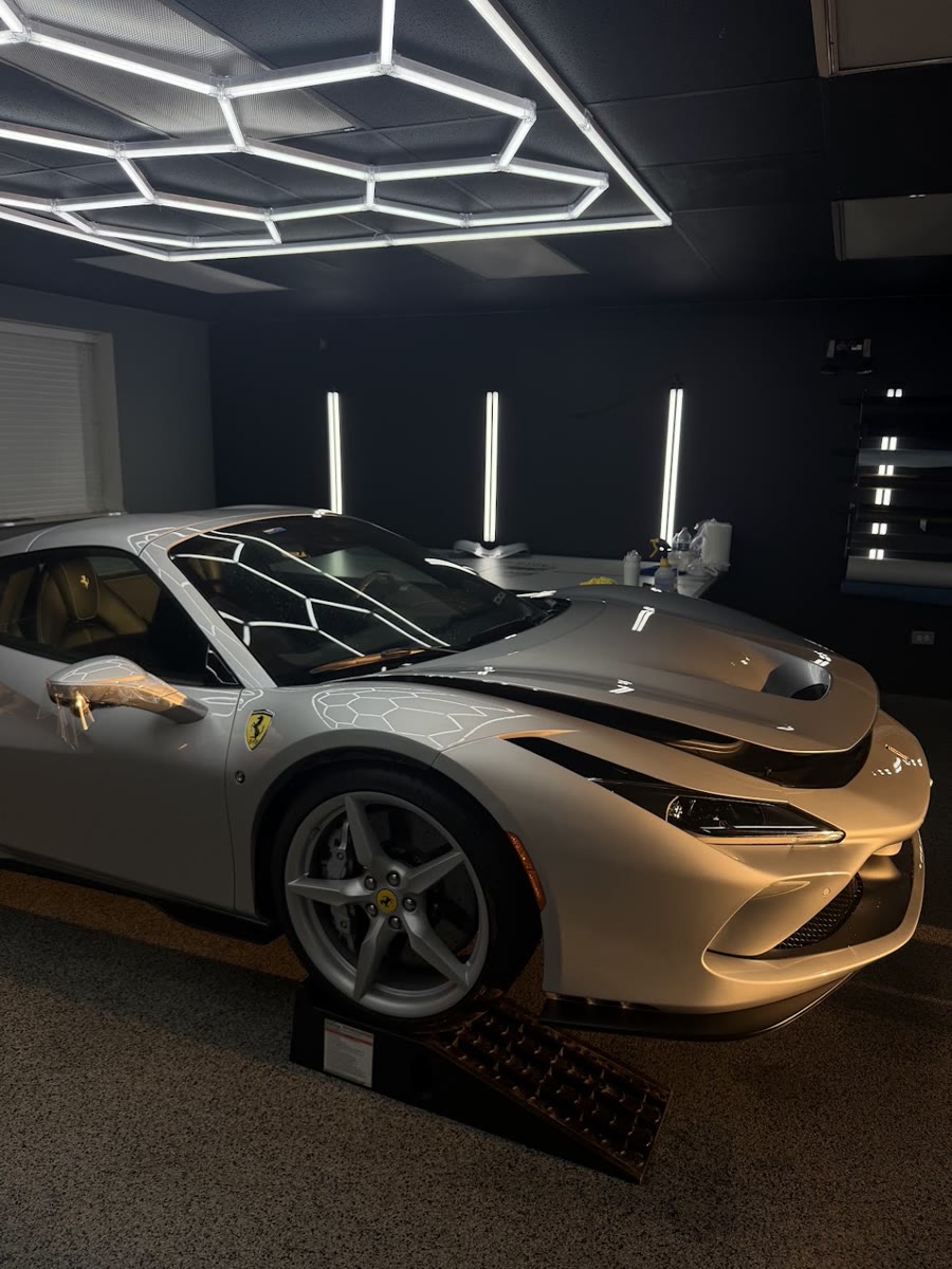 Ferrari F8 wrapped in paint protection film in the Perfect Graphics install bay